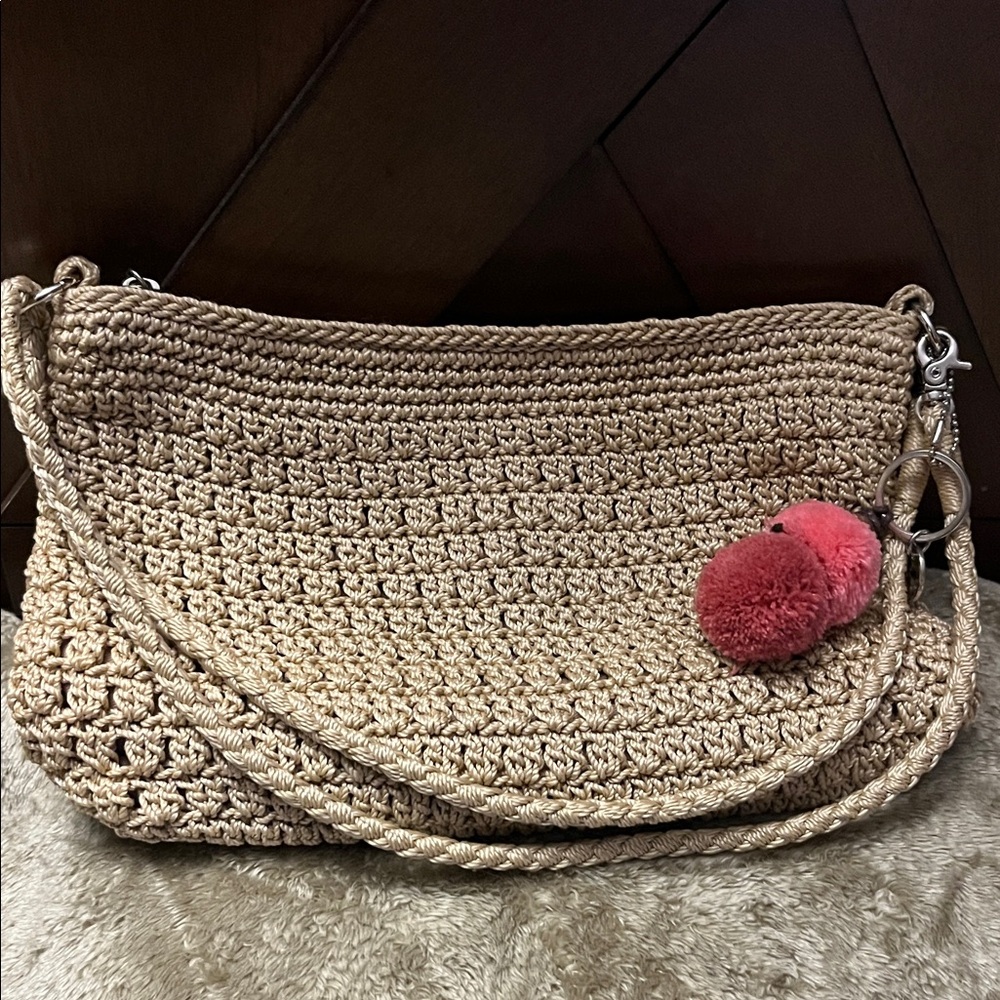 The Sak Tan Crochet Shoulder Bag with Pom Pom